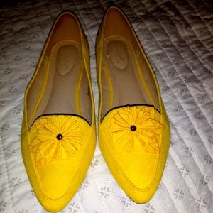 Yellow faux suede flats with cushioned insole